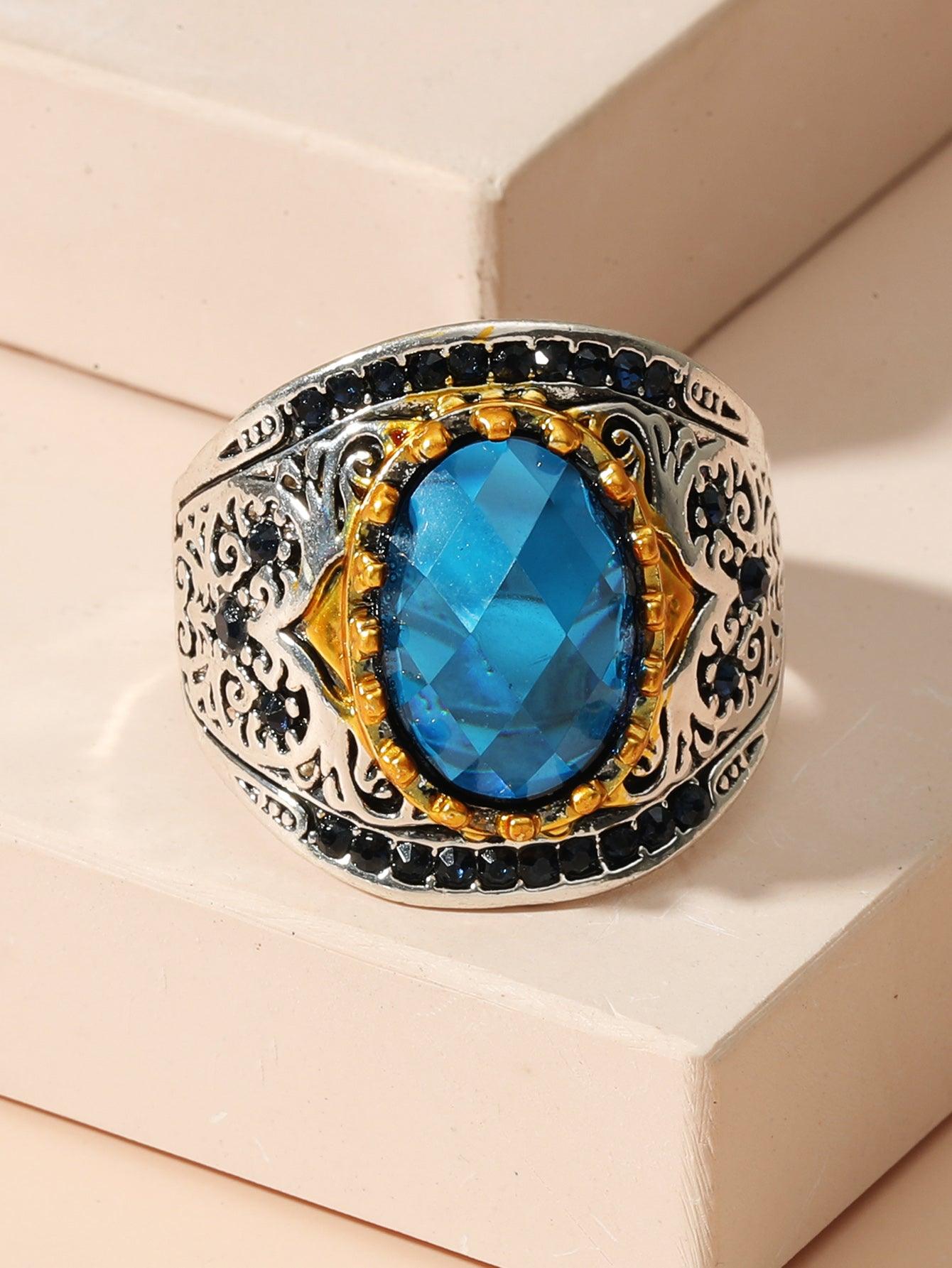Ring in natural light, with the sapphire revealing a rich blue hue that radiates elegance.